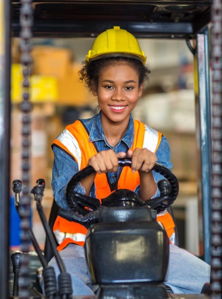 women worker at forklift driver happy working in industry factory logistic ship. women worker at forklift driver happy working in industry factory logistic ship.
